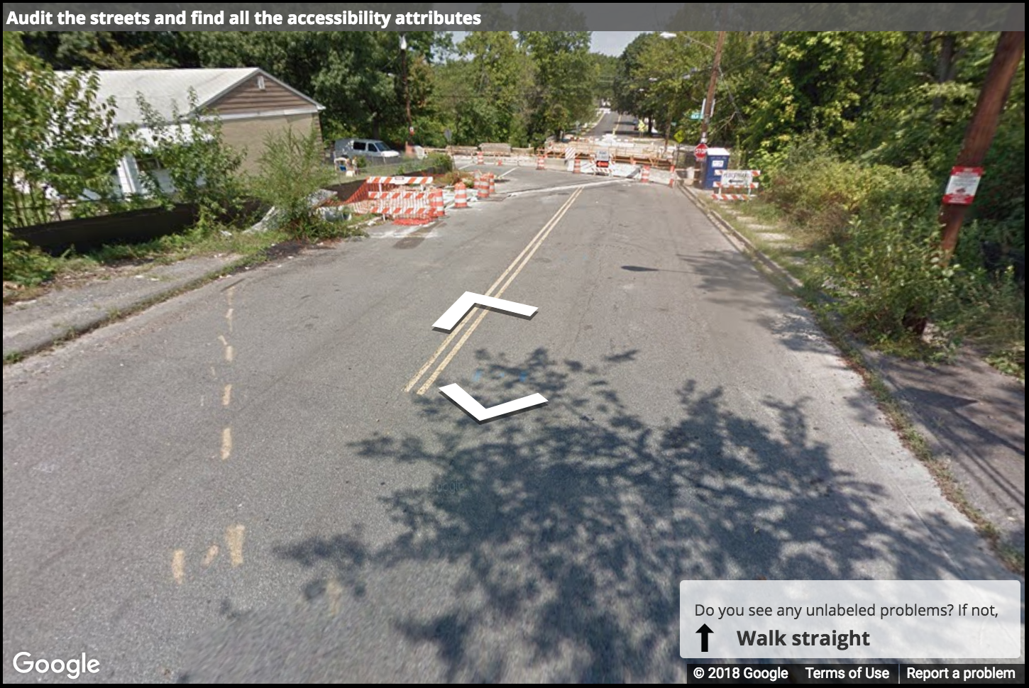 A Street View image of a road with construction