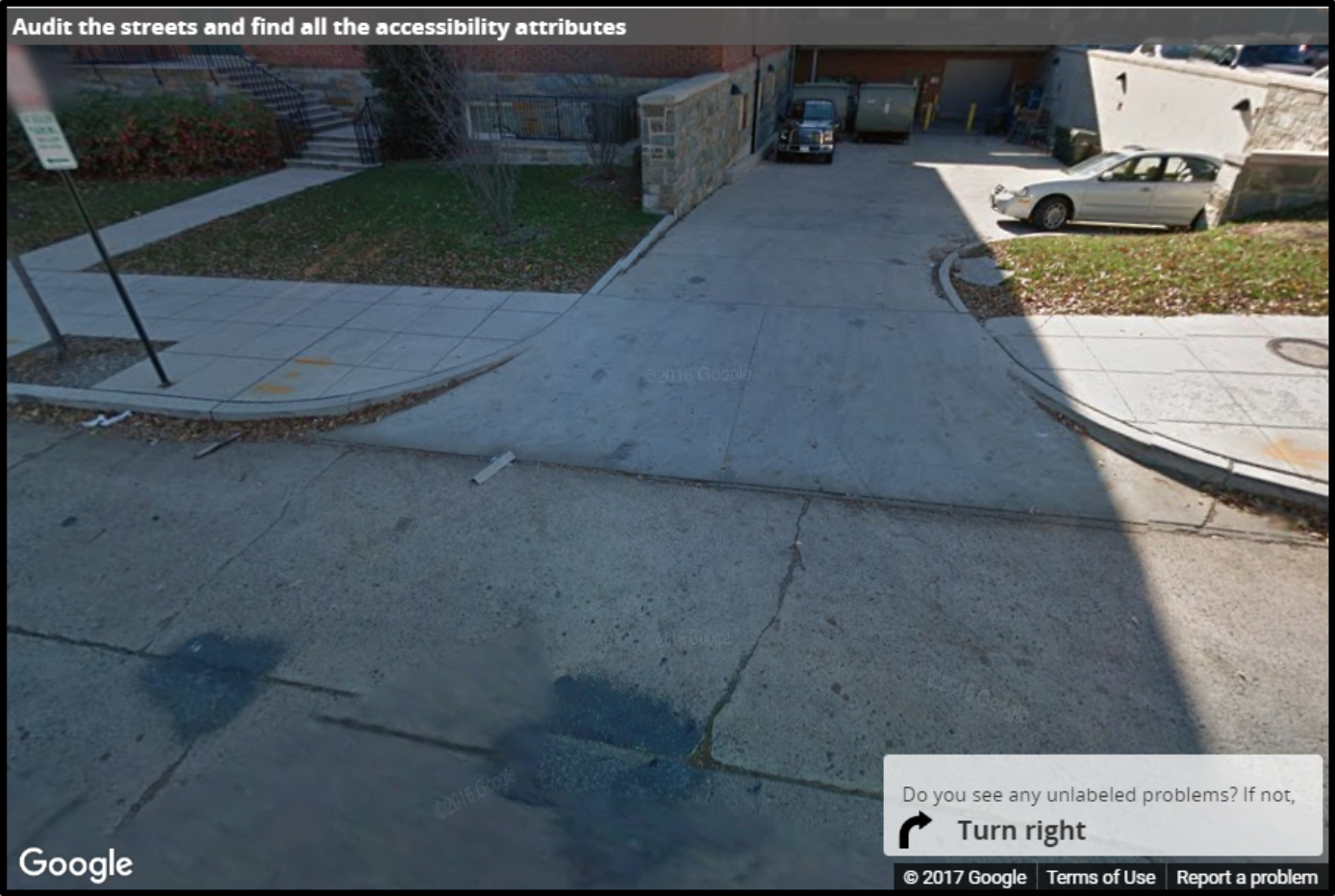 A Street View image of a driveway level with the sidewalk